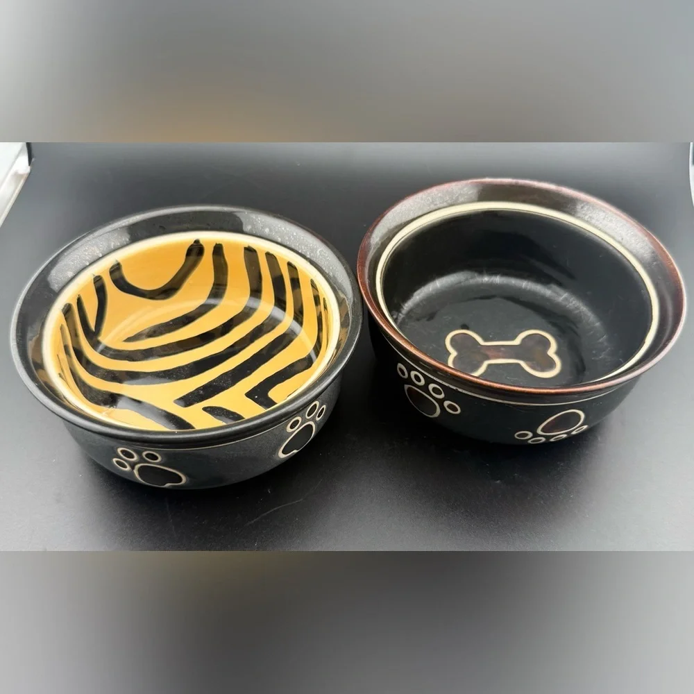 2 small dog dishes. Chic tiger print and bone print. 5”